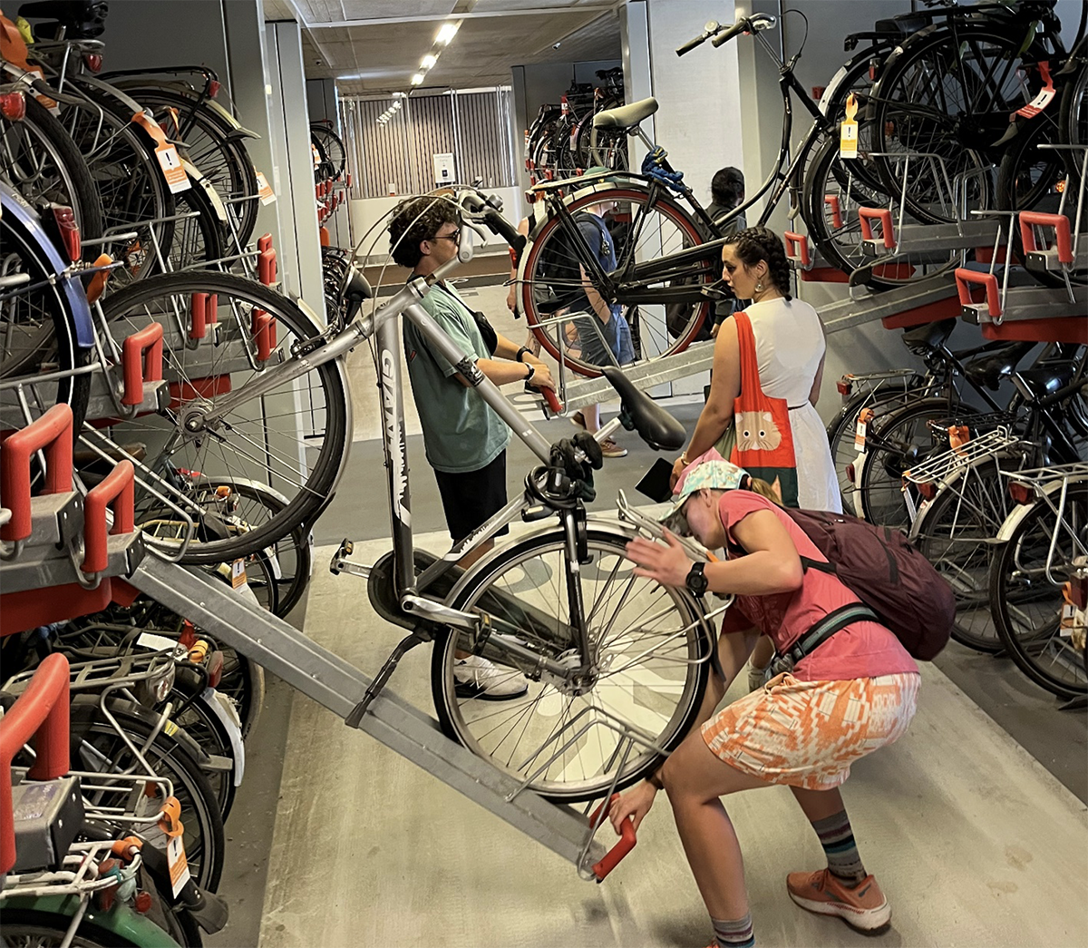 photo: Students checking out the largest bicycle parking garage in the world: 12,500 secure and free bike parking spaces underneath the Utrecht Central Train Station.