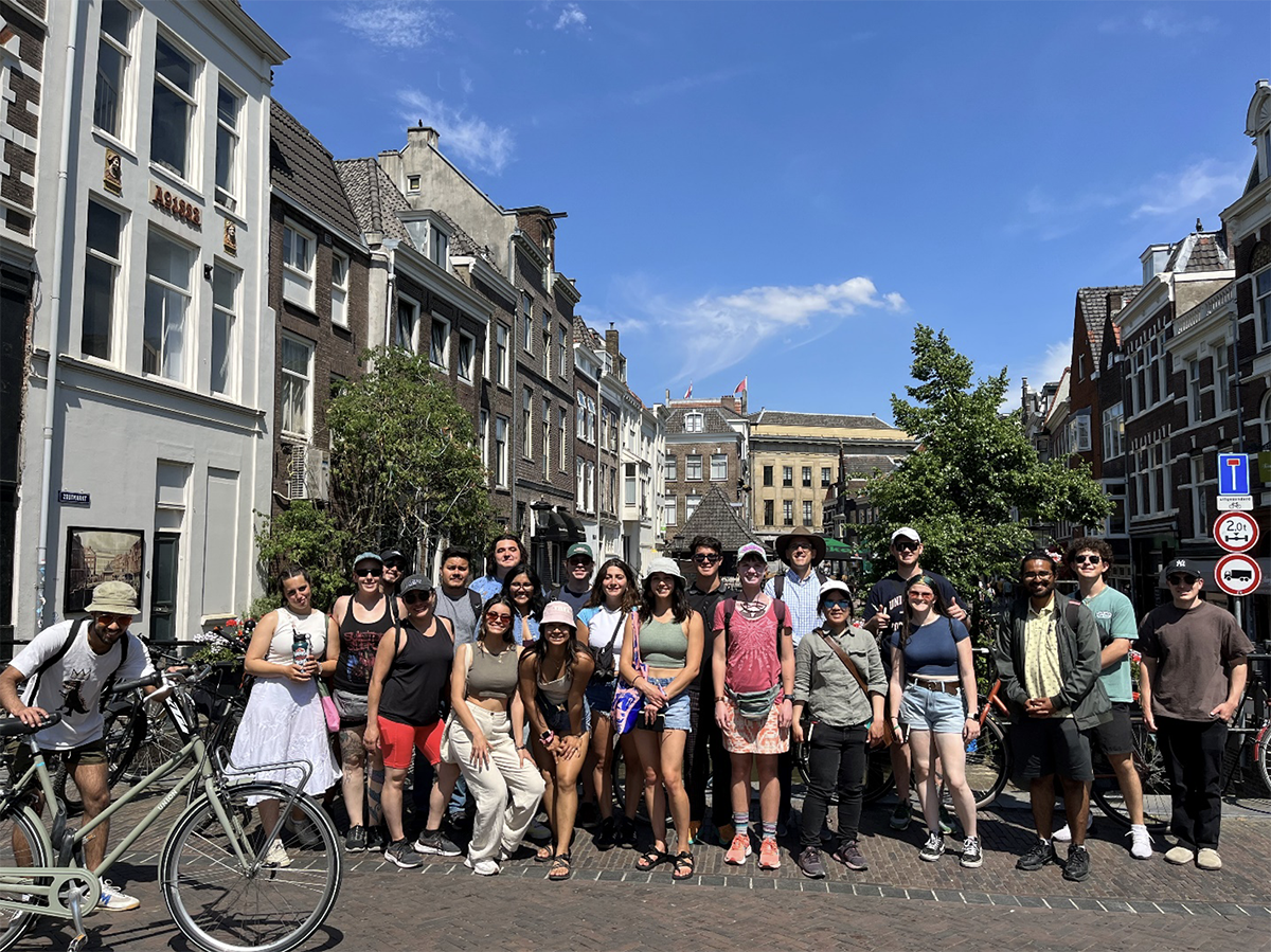 photo: Students on Maartensbrug next to the Dom Tower and St. Martin’s Cathedral in Utrecht.