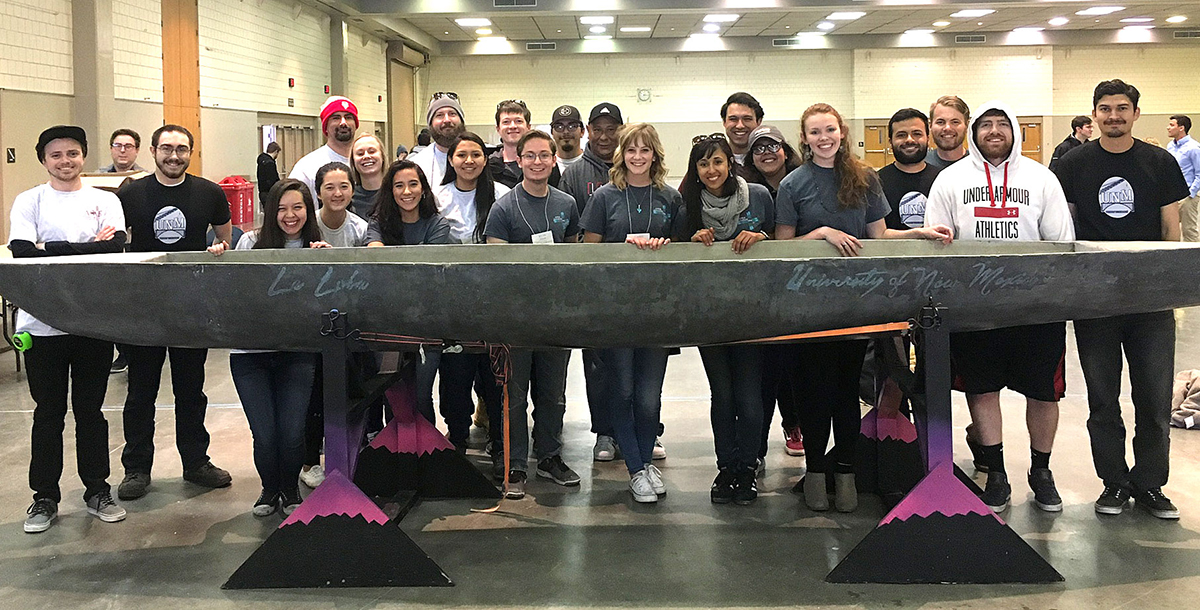 photo of students with canoe