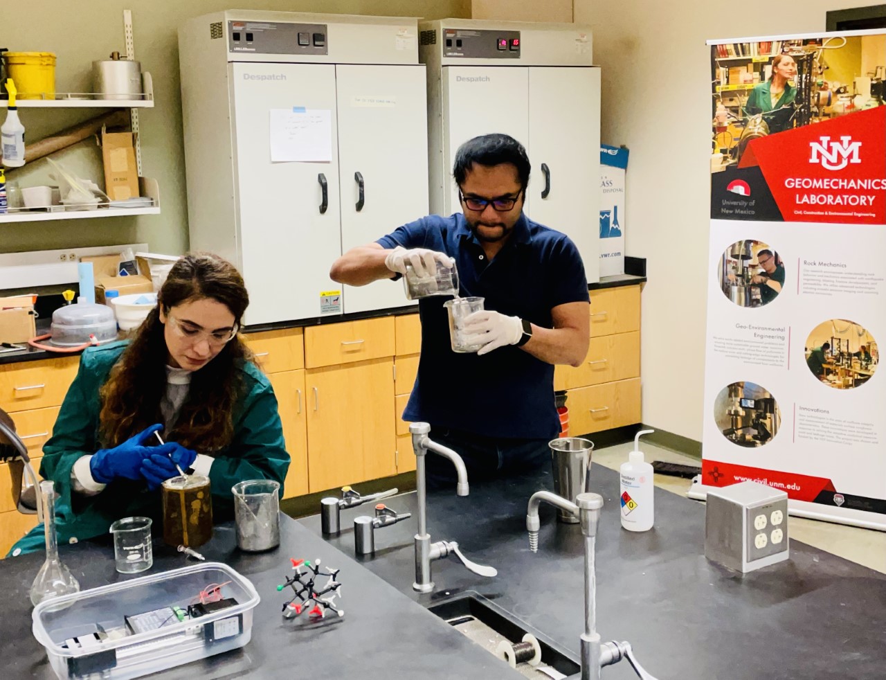 photo: Mahya Hatanbeigi and Ishtiaque Anwar working in the lab together