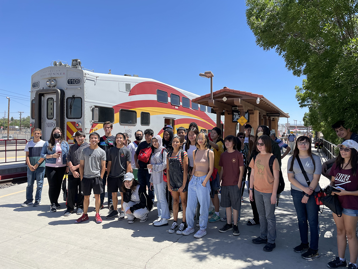 photo: students in front of Railrunner train