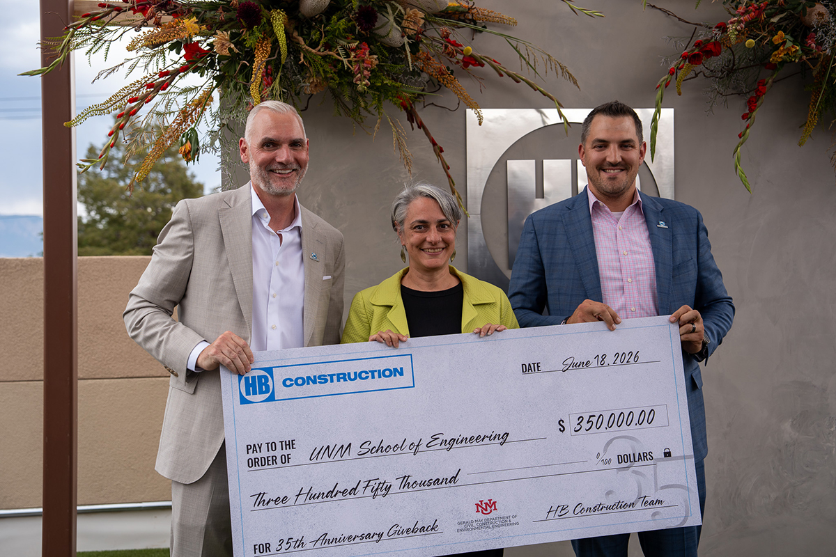 photo: Donna Riley with large check from HB Construction